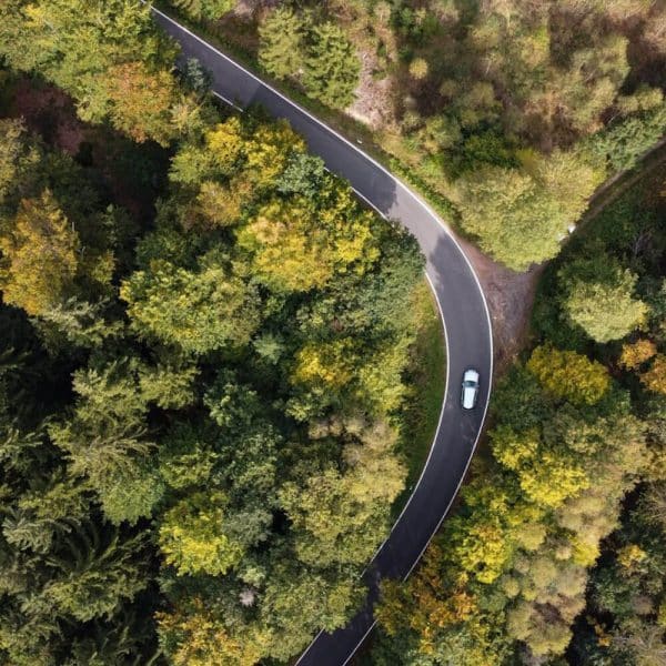 road with a car taken by a drone